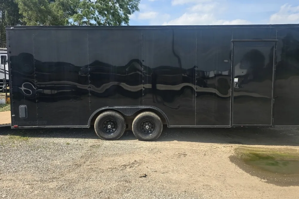 Eye Fly Trucking's black tandem-axle enclosed car trailer